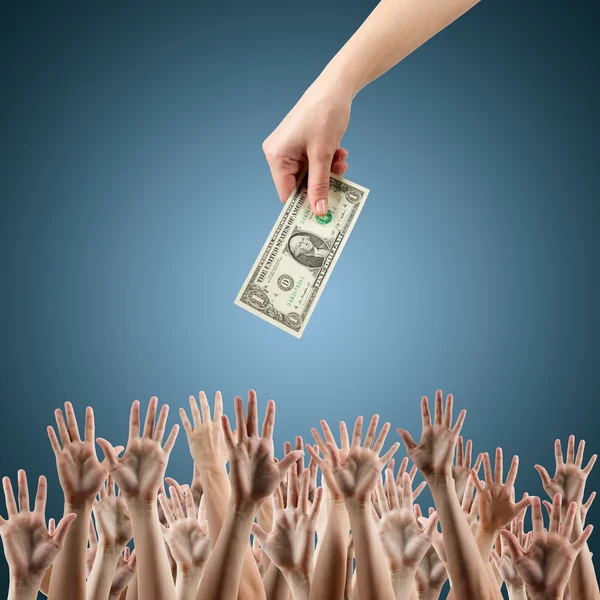 Female hand holding money dollars offering them many hands reaching out for earning money. Rich and poor concept. Competition in the labor job market. Line for unemployment benefits Blue background — Stock Photo, Image