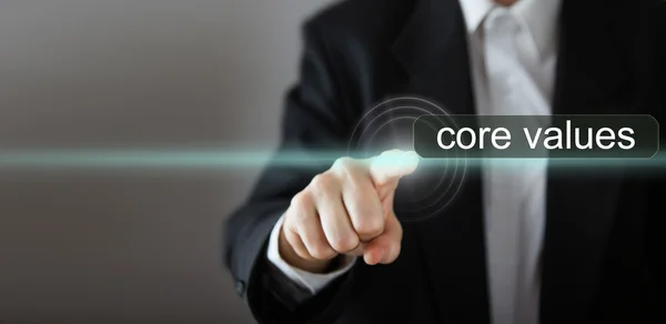 Core values. Businessman's hand pressing the icon with text "core values" on virtual screens. Business, technology, internet and networking concept. Copy space. — Stock Photo, Image