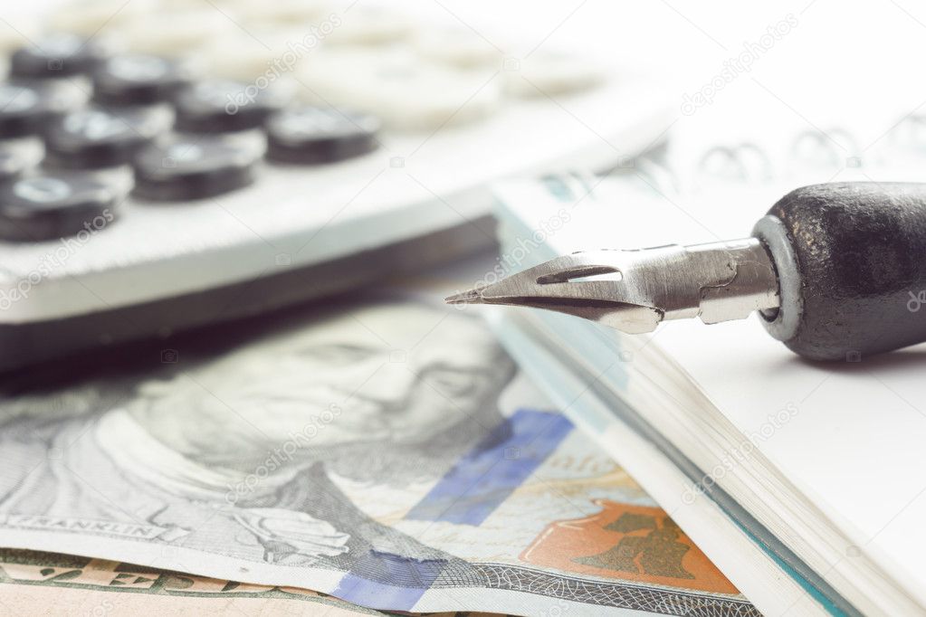 Money close up view. Business concept. Counting money on calculator and signing documents at office workplace, office work. Financial Accounting - money and calculator