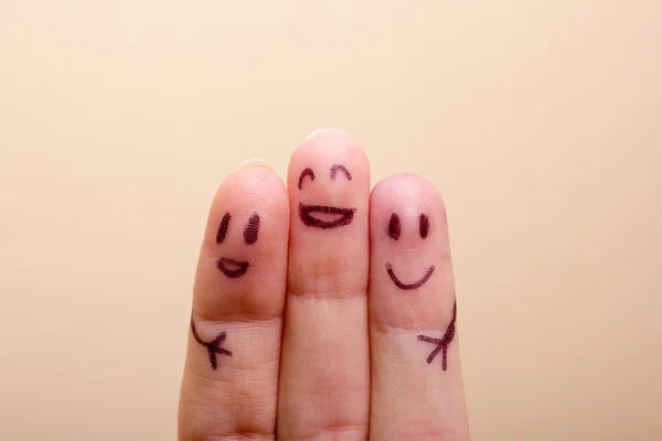 three smiling fingers that are very happy to be friends