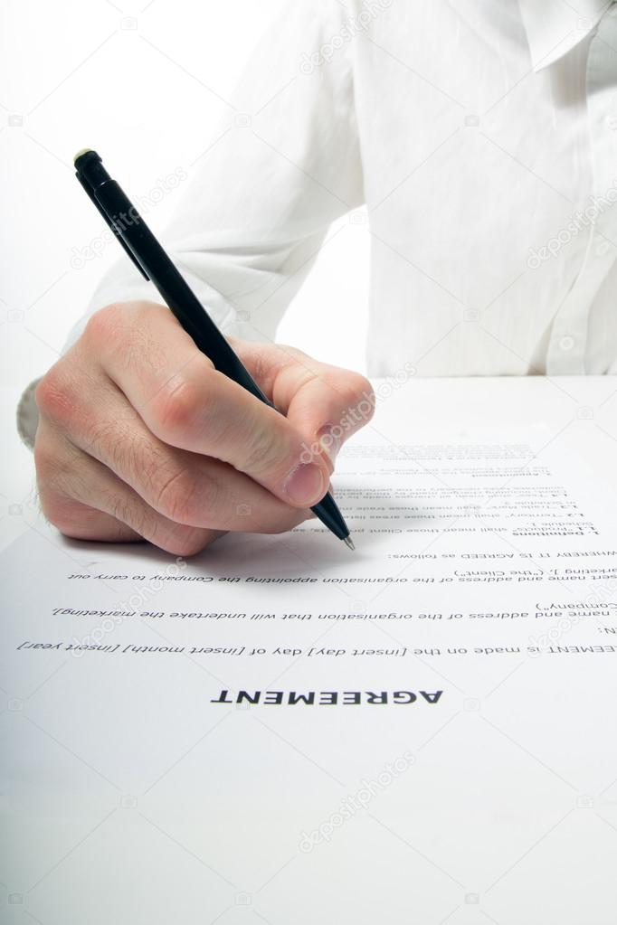 Businessmans hand signing papers. Lawyer, realtor, businessman