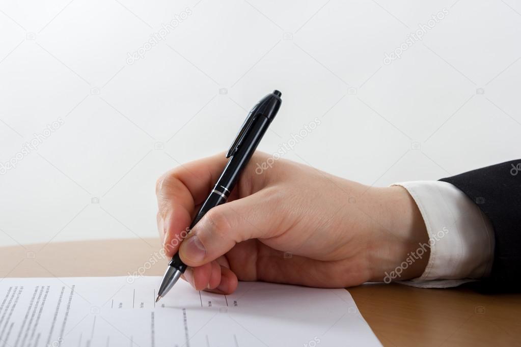 Businessmans hand signing papers. Lawyer, realtor, businessman