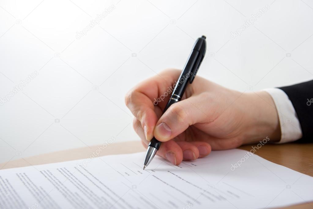 Businessmans hand signing papers. Lawyer, realtor, businessman