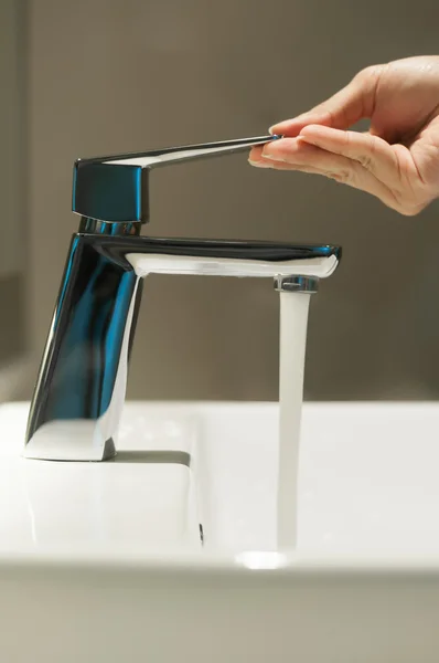 Close up of Hand with faucet and water flow. — Stock Photo, Image