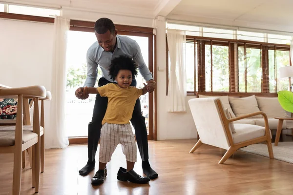 Smiling African Little Child Having Fun Stepping His Dad Shoe — Stock Photo, Image