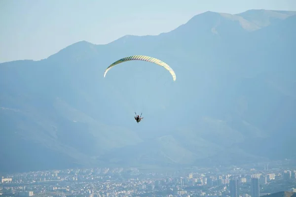 Flying paragliding  at Pamukkale  in the evening. It is a new attraction for Denizli after cotton castle.