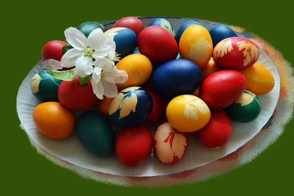 Interesting platter with painted eggs for the Easter holidays on a stylized green background