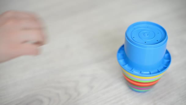 Woman Hand Pyramid Multi Colored Cups Mom Plays Baby — Stock Video