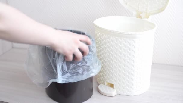 Woman Puts Package Black White Trash Bin — Stock Video