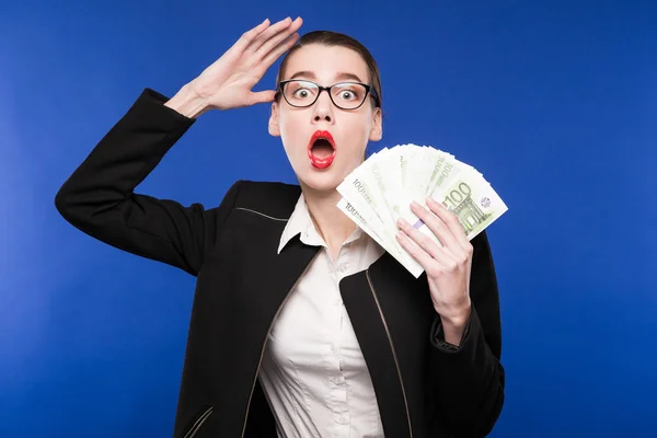 Woman in a dark suit and with money in hand — Stock Photo, Image