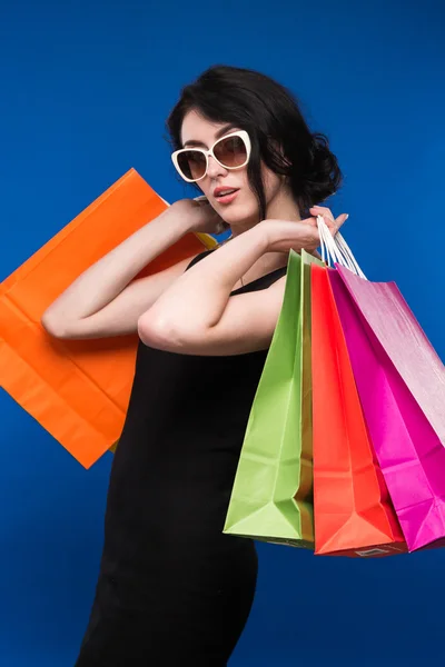 Ragazza con pacchetti — Foto Stock