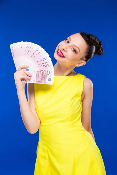 Girl holds money in hands — Stock Photo, Image