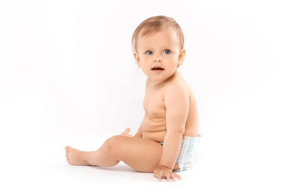 Baby sitting in diaper — Stock Photo, Image