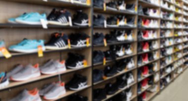leather shoe store with a wide selection of colors, models and sizes, blurred and defocused