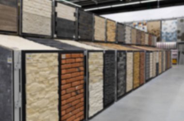 blurred and defocused: brick imitation plaster walls, samples in the store