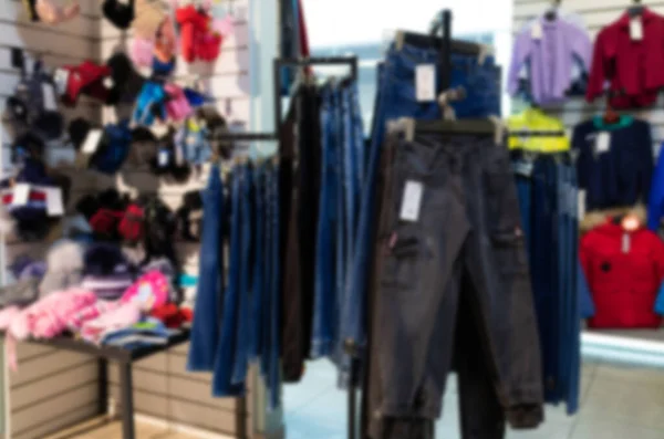 Department store with a large assortment of clothes, blurred and defocused — Foto Stock