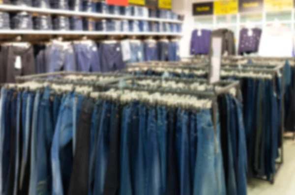 Clothing store with a wide selection of trousers, blurred and defocused — Foto Stock