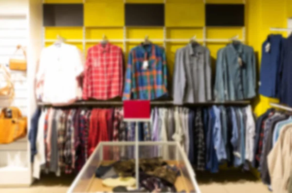 Clothing store with a large assortment of shirts, blurred and defocused — Foto Stock