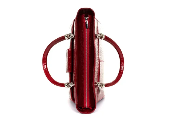 Red stylish ladies leather bag on a white background, top view — стоковое фото
