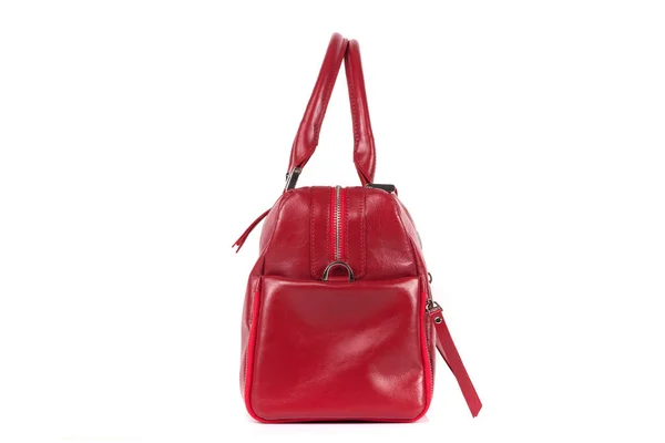 Red stylish ladies leather bag on a white background, side view — стоковое фото
