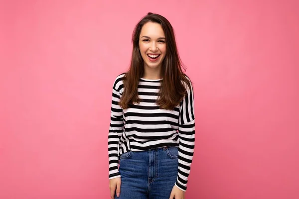 Portrait of positive cheerful fashionable woman in casual clothes isolated on pink background with copy space — Stock Photo, Image
