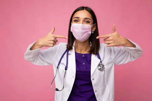 Female Doctor Wearing Medical Mask and Stethoscope isolated on background