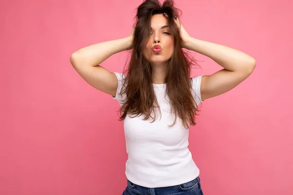 Photo shot of cute nice sexy charming gorgeous attractive pretty youngster happy woman wearing white t-shirt for mockup isolated over colorful background with copy space and giving kiss — Stock Photo, Image