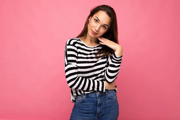 Photo shot of cute attractive pretty young brunette woman wearing casual striped longsleeve isolated over colorful background with copy space — Stock Photo, Image