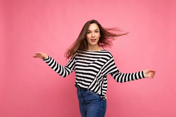 Portrait of positive cheerful fashionable woman in casual clothes isolated on pink background with copy space — Stock Photo, Image