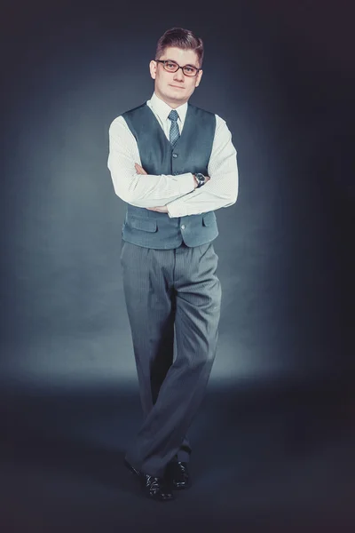 Successful business man standing in a classic vest in full growt — Stock Photo, Image