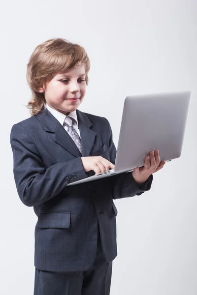 Young man in shirt and tie with a laptop — Stock Photo, Image