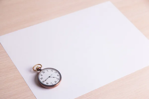 Classic clock on a white sheet of paper — Stock Photo, Image