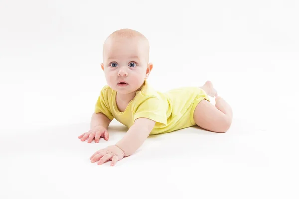 Cute baby lying on the background and smiling — Stock Photo, Image