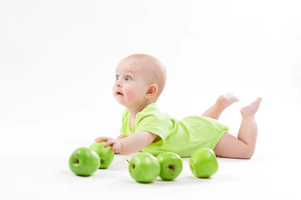 Cute baby lying on the background and smiling — Stock Photo, Image