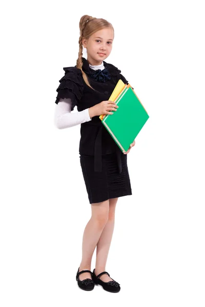 Little schoolgirl on a white background in a business suit looki — Zdjęcie stockowe