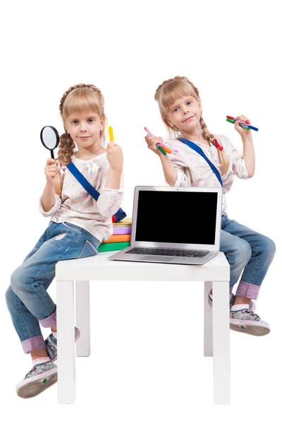 Two cheerful girls twins having fun on a white background surrou — Stock Fotó