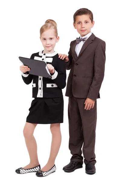 Little boys and girls in business suits on white background with — Stock Fotó