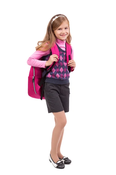 Colegiala con una mochila sobre un fondo blanco sonriendo — Foto de Stock