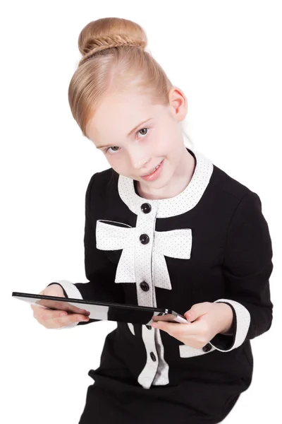 Little schoolgirl in a business suit on a white background with — Stock fotografie