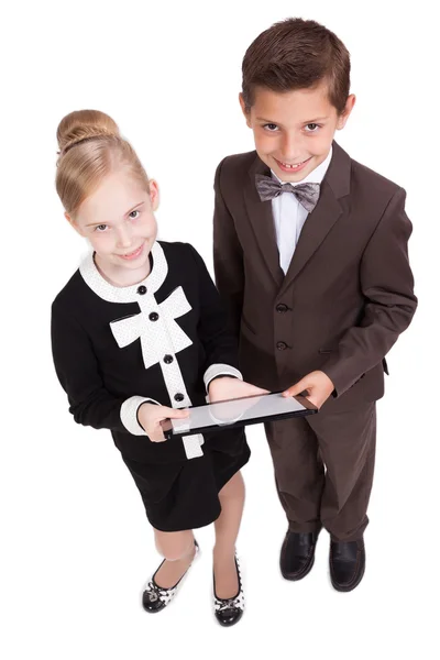 Little boys and girls in business suits on white background with — Stockfoto