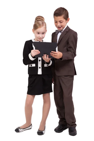 Little boys and girls in business suits on white background with — 图库照片