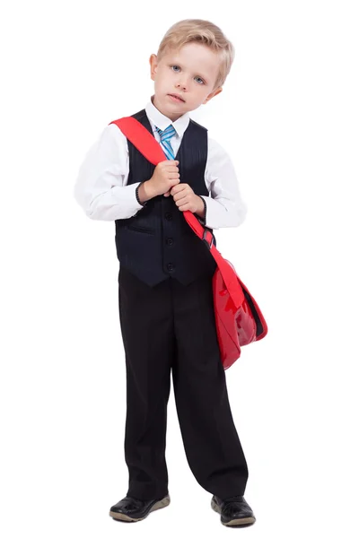 Pequeño colegial sobre un fondo blanco con una mochila en un busi — Foto de Stock