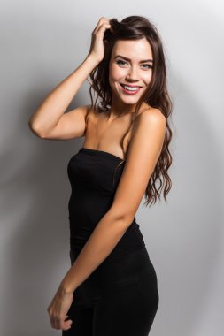 Student smiling brunette with white teeth on a white background