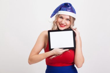 The beautiful blonde with big breasts standing on a white backgr