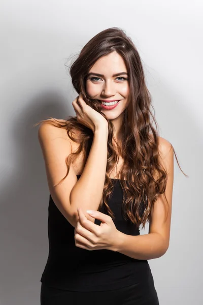 Business portrait of a smiling brunette in a business suit on a — Φωτογραφία Αρχείου