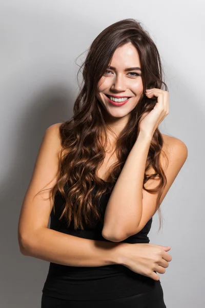 Business portrait of a smiling brunette in a business suit on a — 스톡 사진