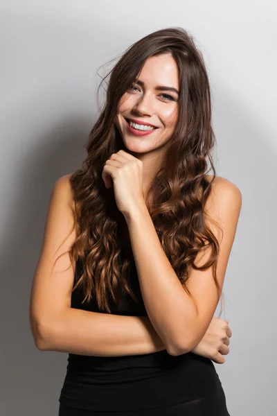 Business portrait of a smiling brunette in a business suit on a — 스톡 사진