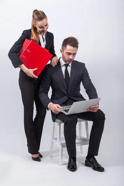 Young creative businesswoman sitting on a chair with a laptop on — Φωτογραφία Αρχείου