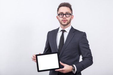 Creative young businessman in a business suit with a tie and sun
