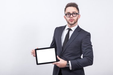 Creative young businessman in a business suit with a tie and sun
